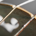 closeup of violin bridge and strings