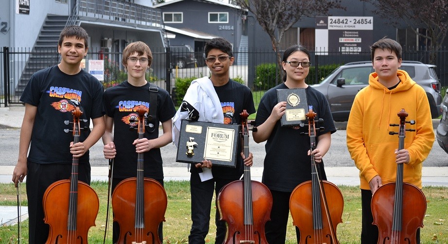 five cello students holding their instruments and awards