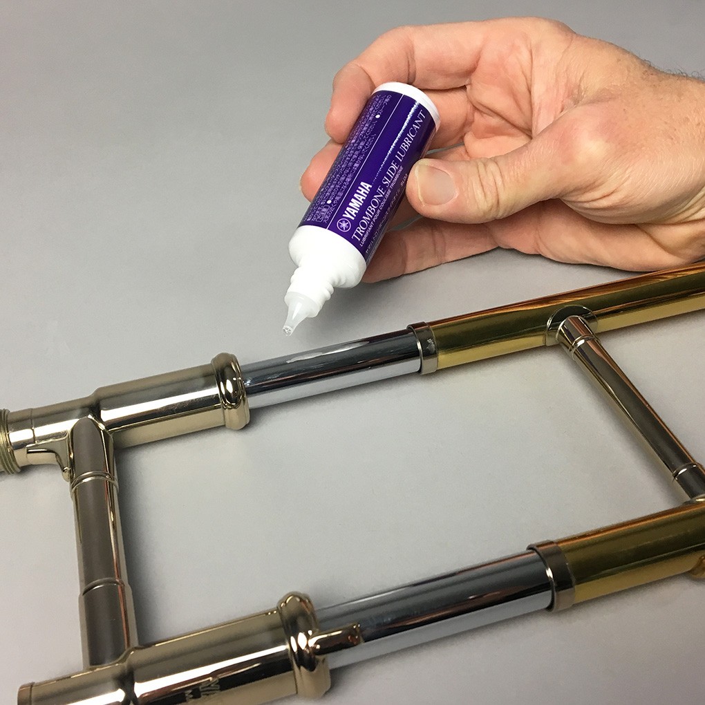 applying liquid trombone slide lubricant on trombone slide