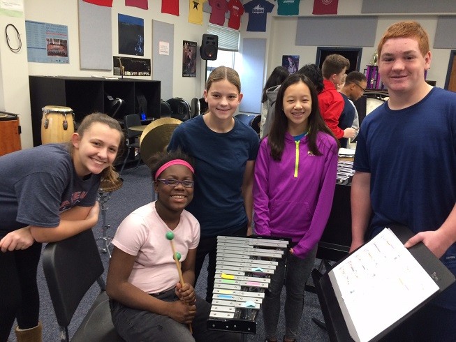 United Sound peer mentors pose with a new musician