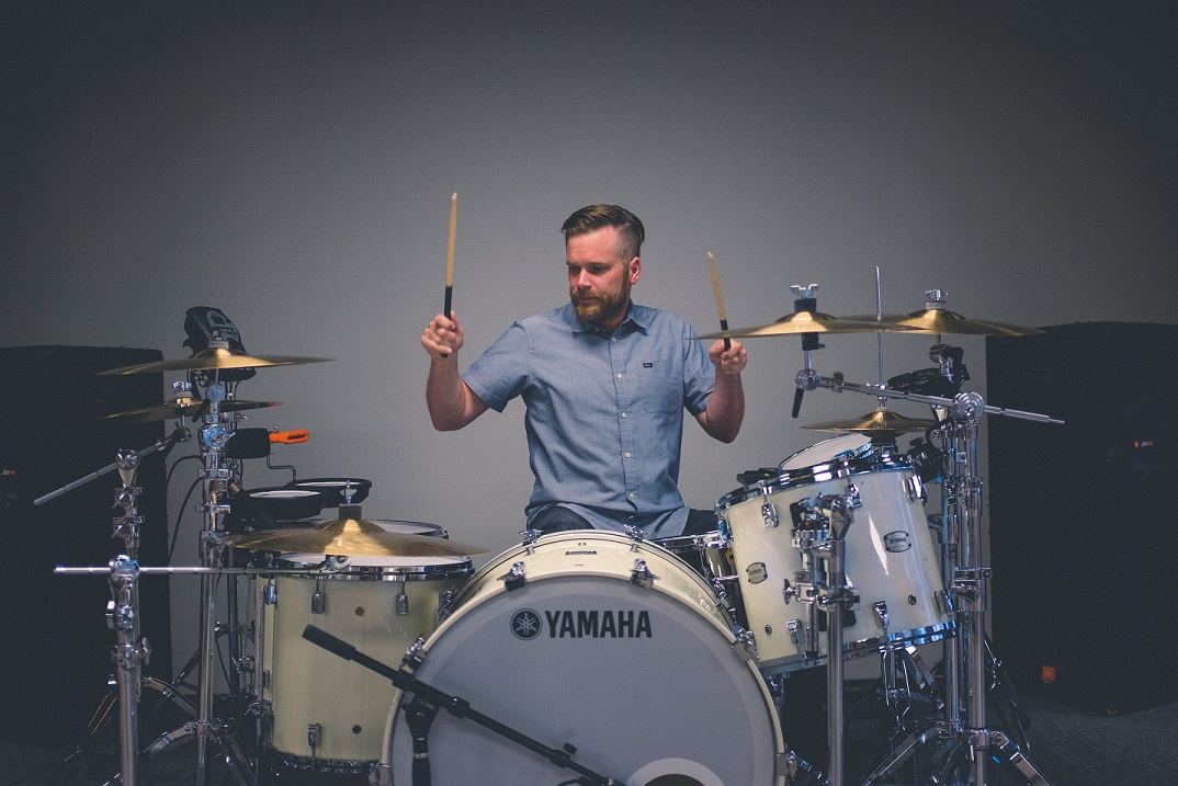 male playing drums 
