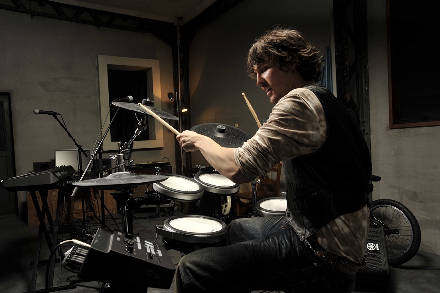 Male playing the drums 