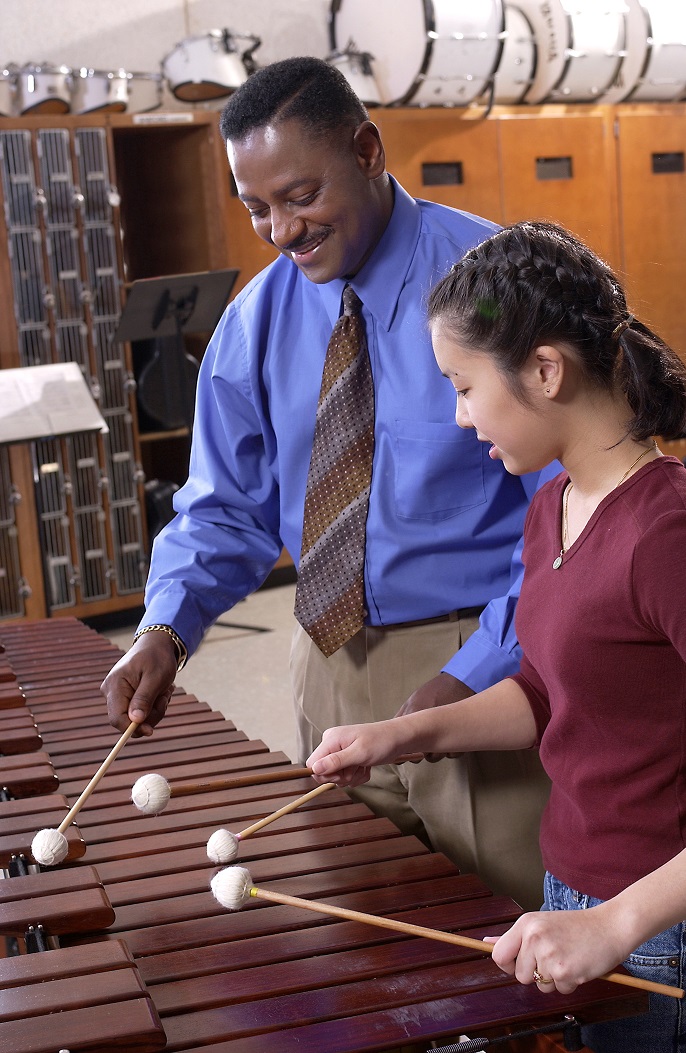 Female marimba student with teacher