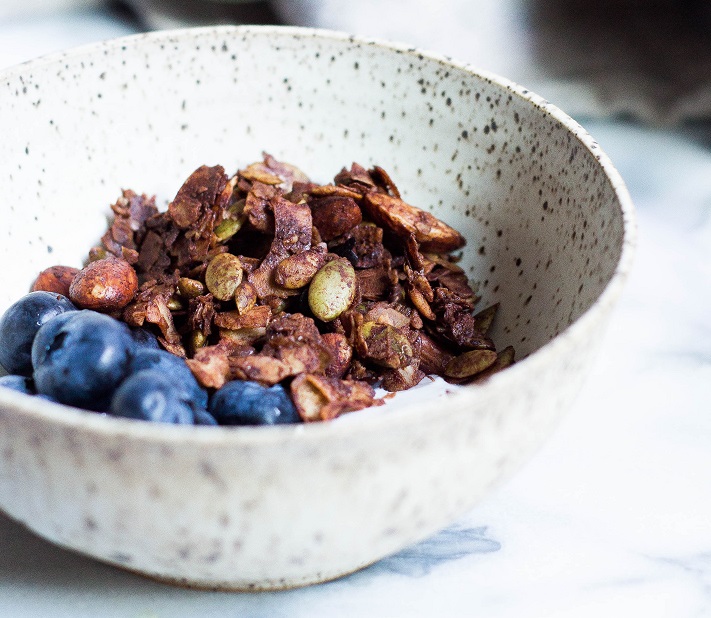 bowl of nuts, granola and blueberries