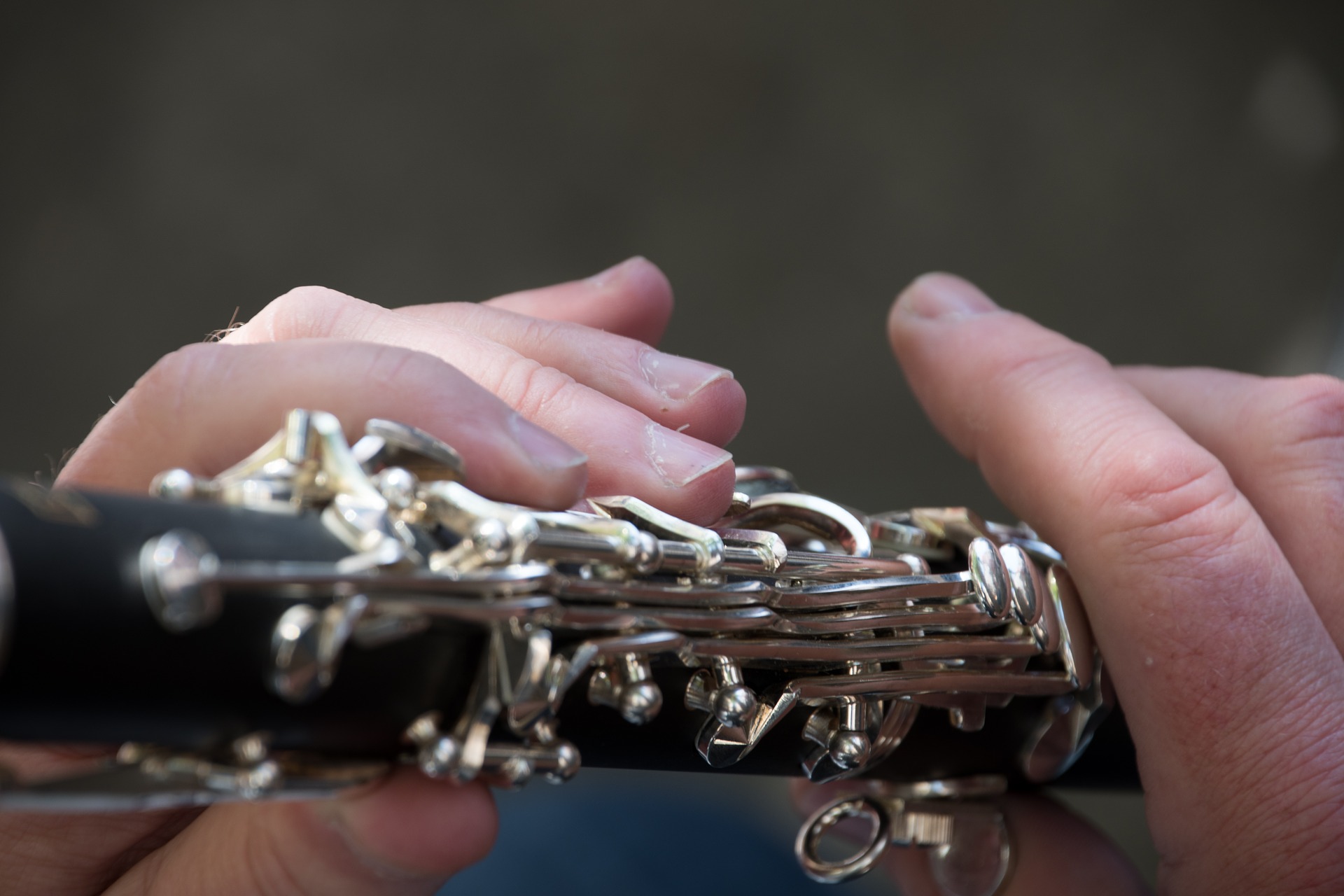 closeup of hands on clarinet