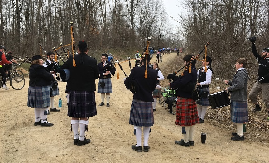 Caledonia Pipes and Drums performing at a bike race