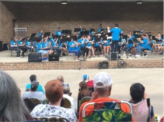 Joliet Central High School band performing on stage
