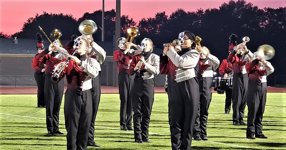 Shelby County High School band members wearing masks and performing Dia de los Muertos routine