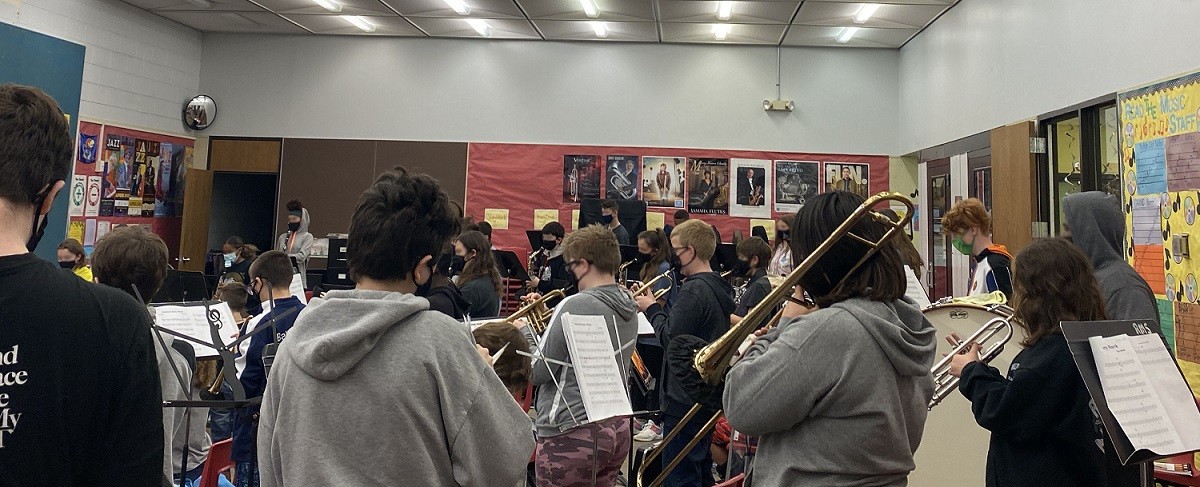 Robinson Middle School Band in music room wearing masks