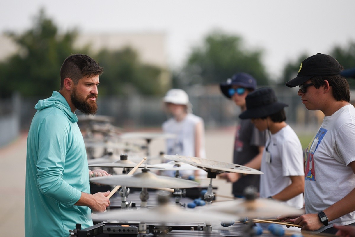 Wakeland High School percussion director Brian Teed with drummers at band camp 