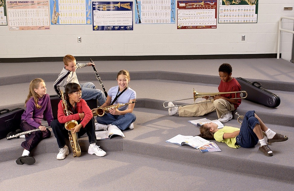 group of students in empty band room 
