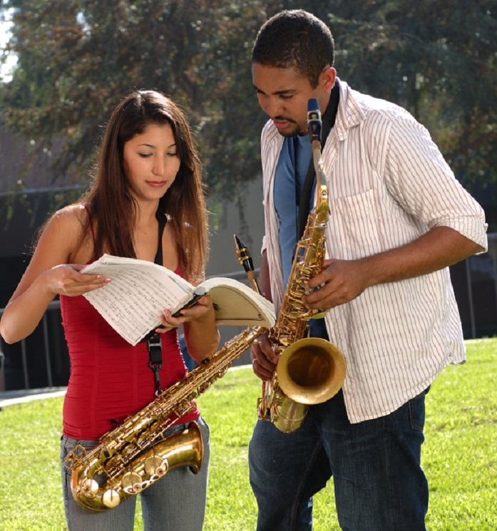 male and female students with saxophones