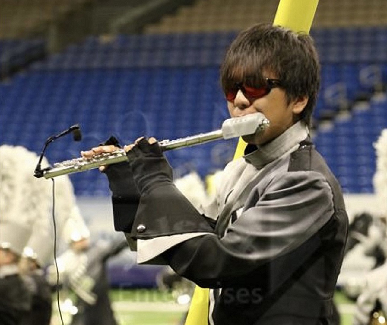 Tomok playing flute