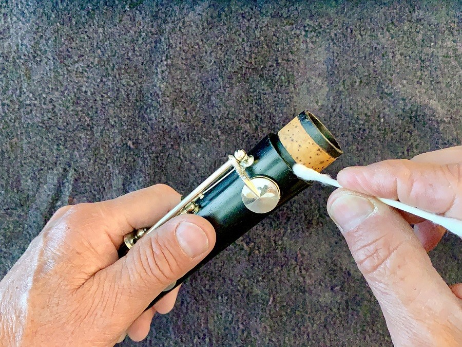 using cotton swab to check outside of tenon for cork grease