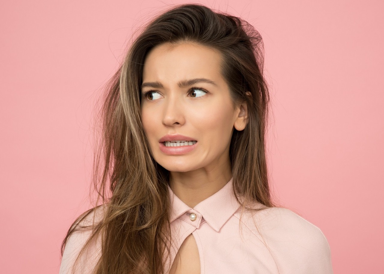 woman making a face that shows she's unsure of herself