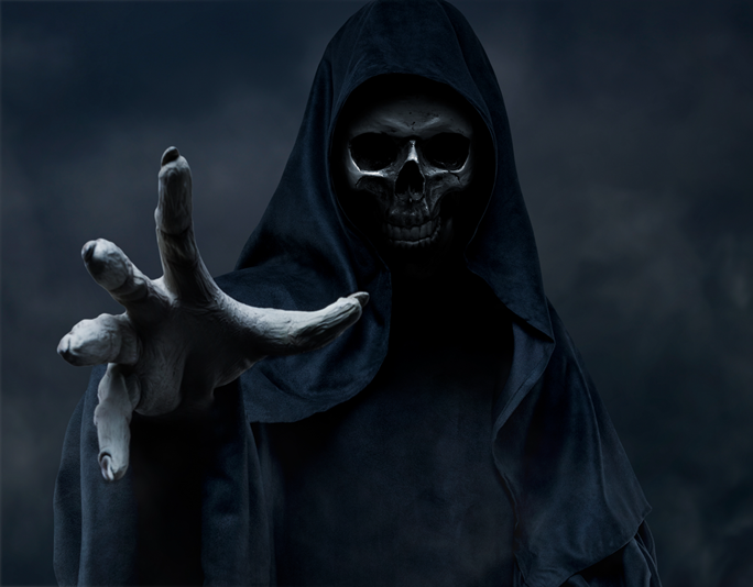 Horror movie type image of skeletal figure in a cape with skull face and creepy hand reaching towards camera.