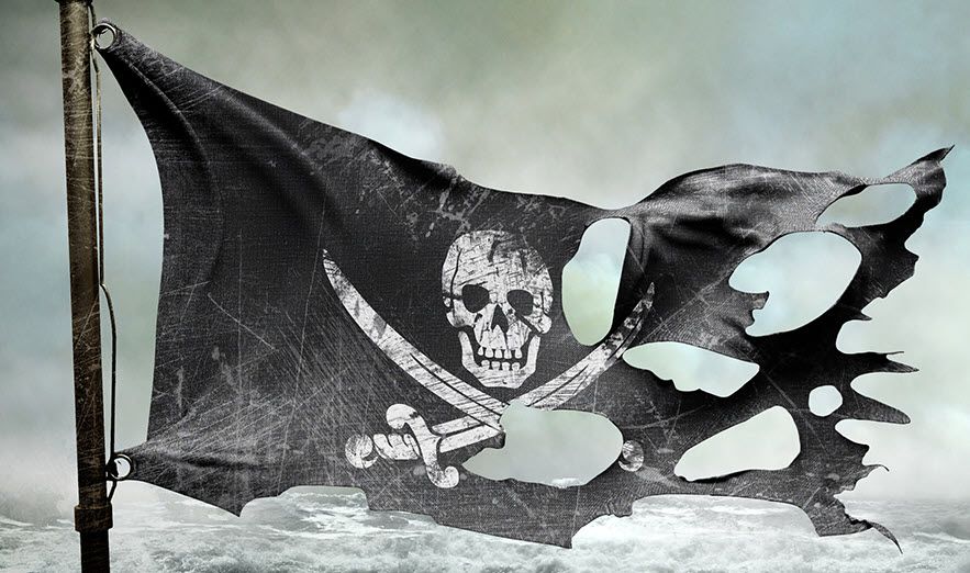 Drawing of a ragged pirate flag (has skull and crossed cutlass swords below the skull on a dark background) flying in a strong wind against a stormy sea.