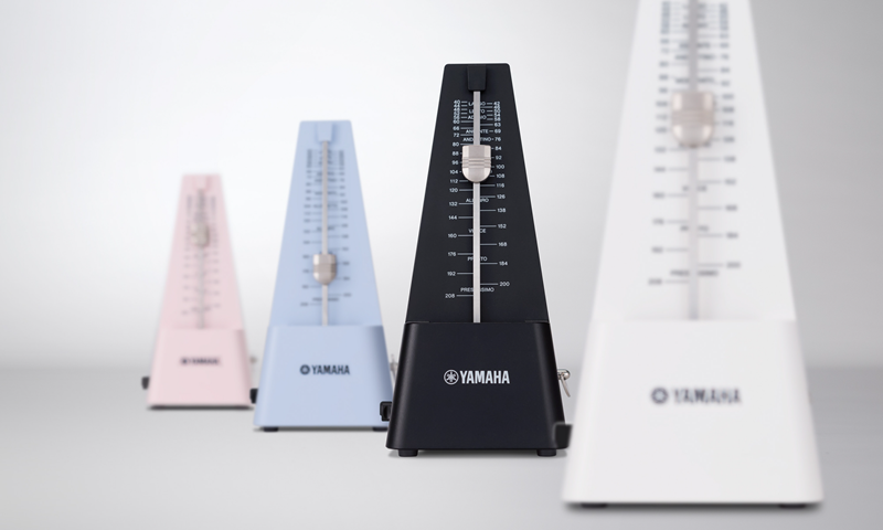 Four metronomes in different colors.
