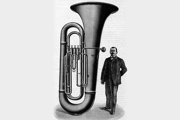 Vintage illustration of man standing next to the Big Carl tuba.