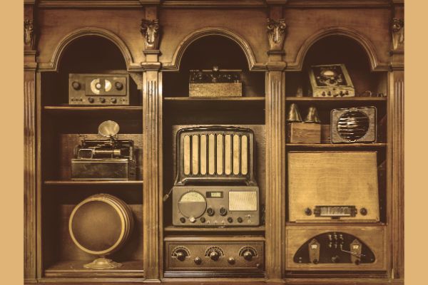 Built-in shelving with vintage audio devices.
