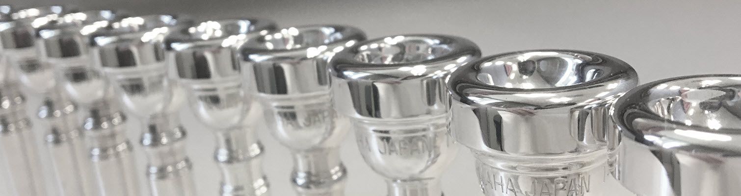 Row of silver mouthpieces.