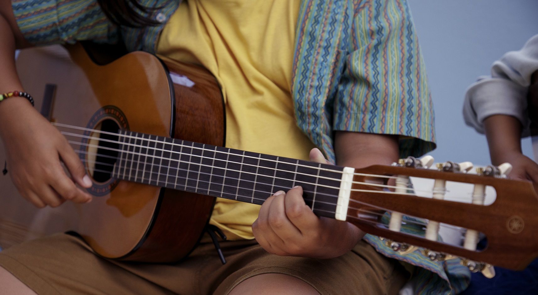student playing guitar