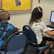 two students working at DAWs