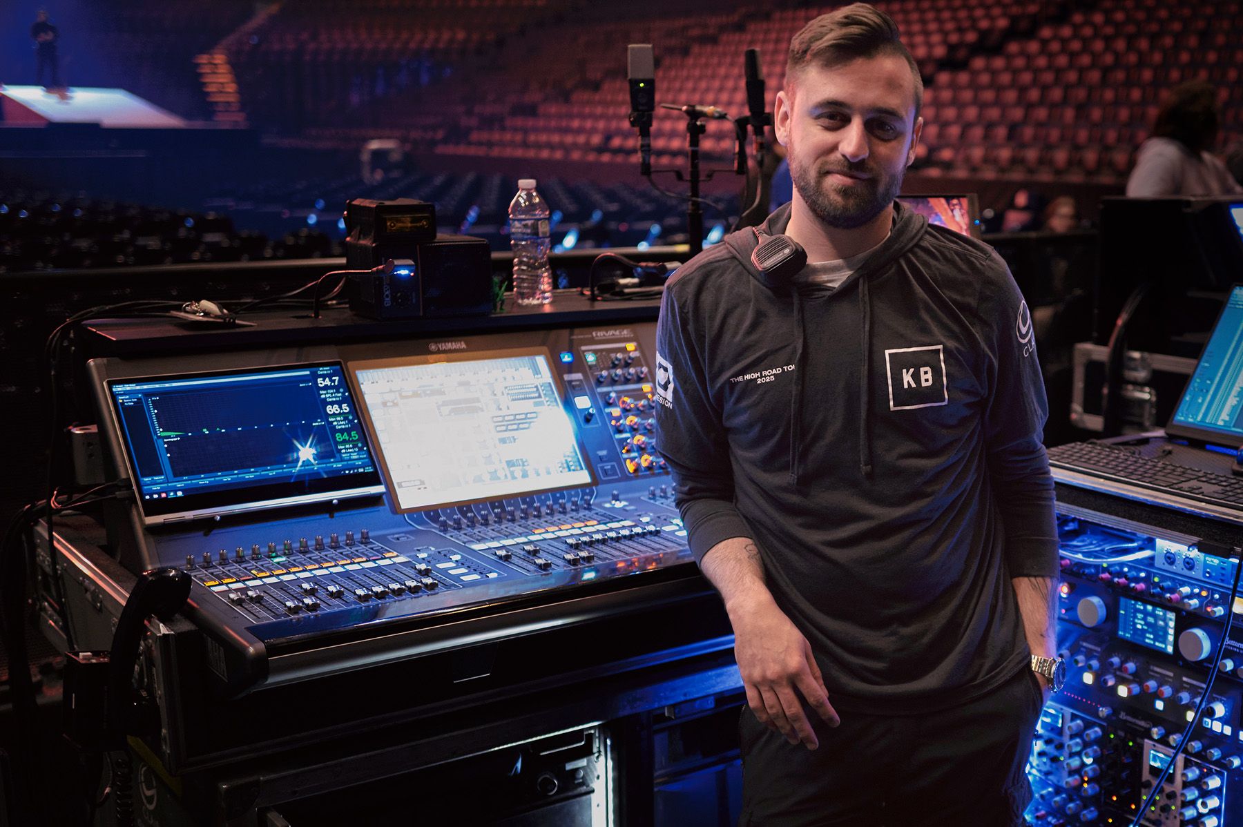 man in front of audio mixer