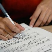 music educator reviewing sheet music