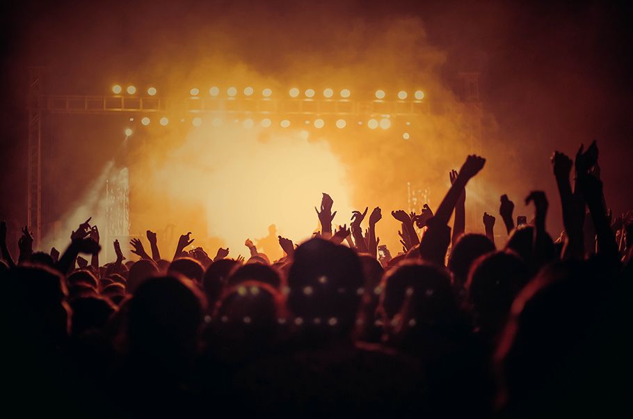 Rock concert seen from the rear of the audience.