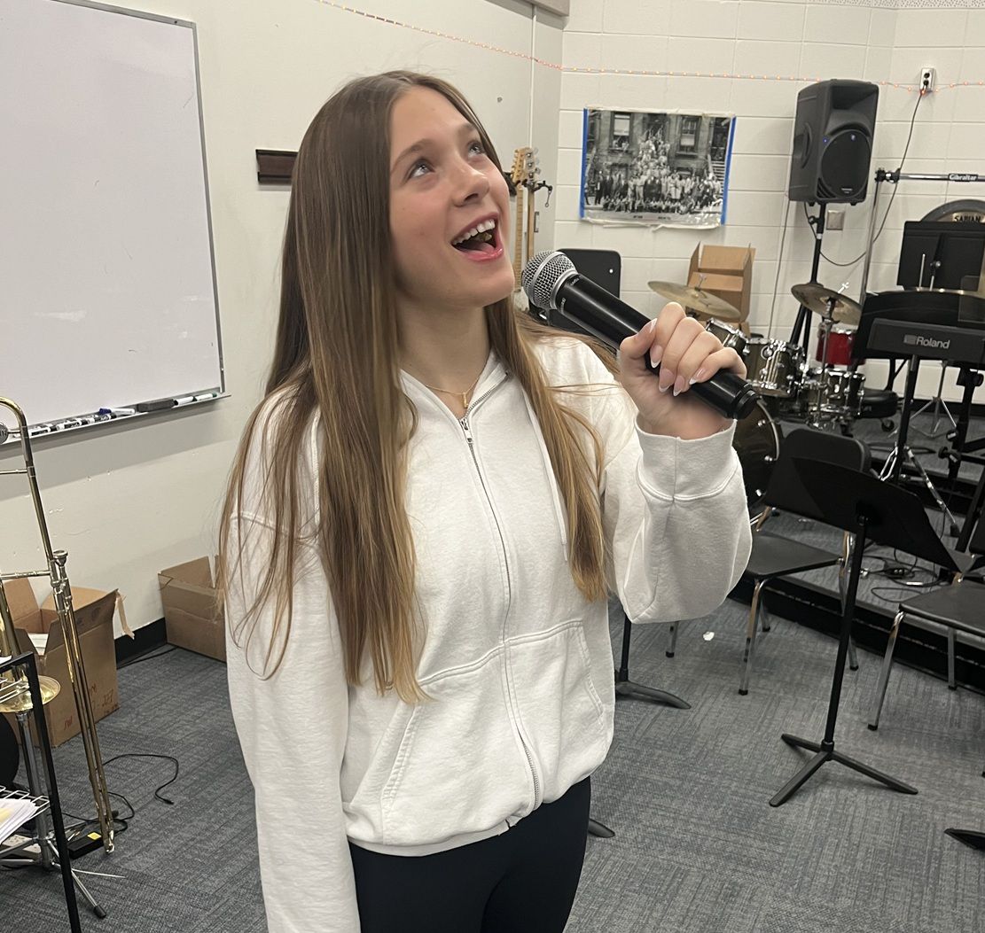 female singing with microphone