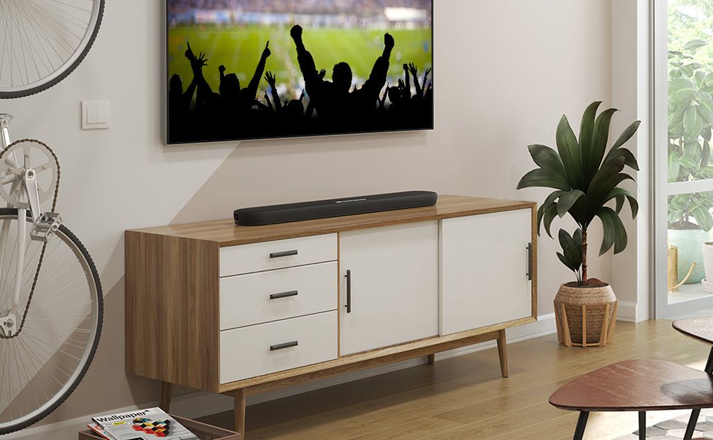 Sport event on TV hanging on living room wall.