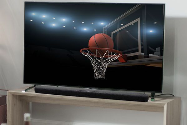 Basketball game shown on living room TV.