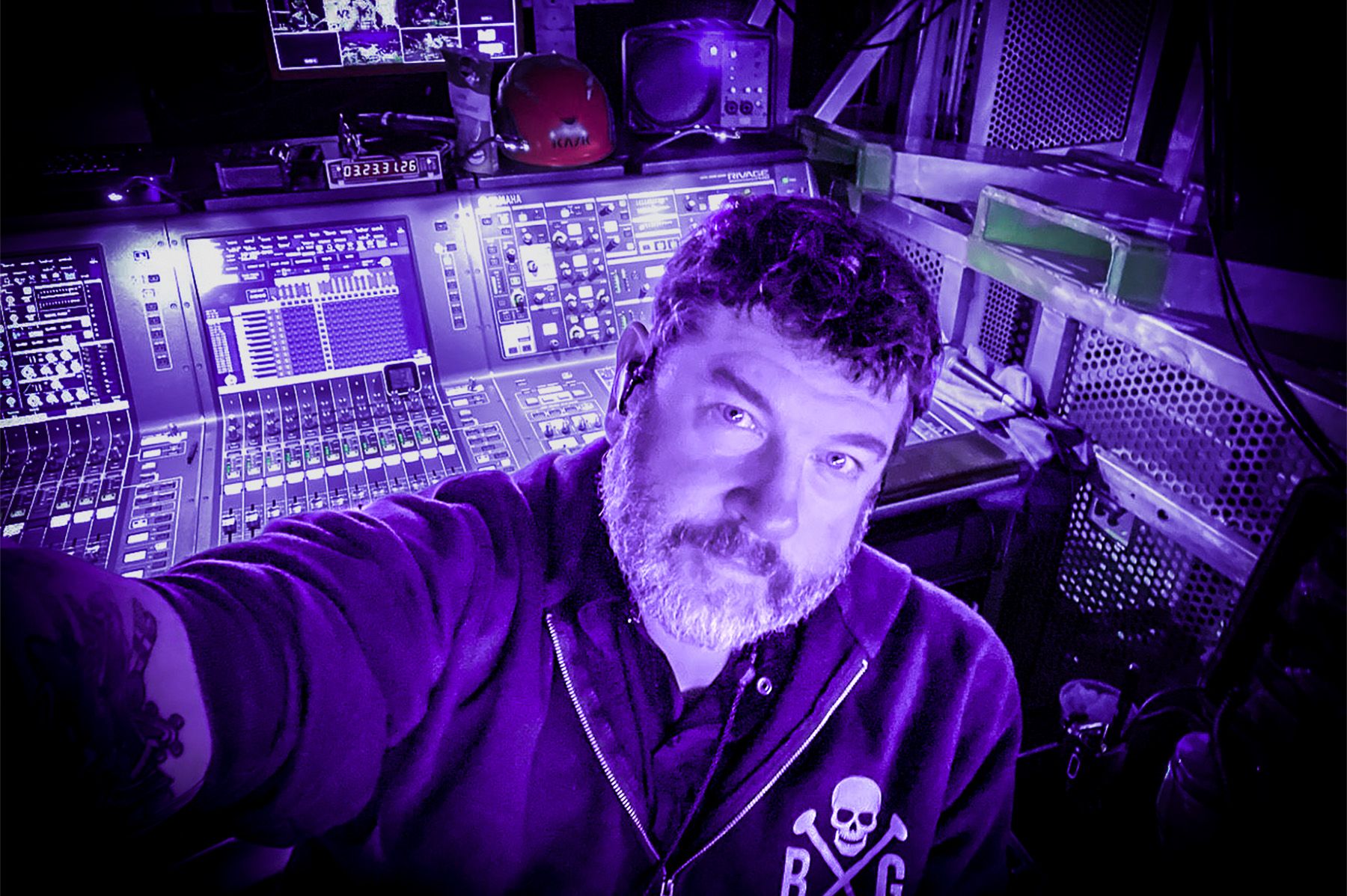 man in front of audio mixer
