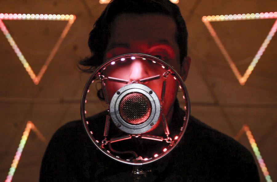 Stylized image of person behind a microphone.