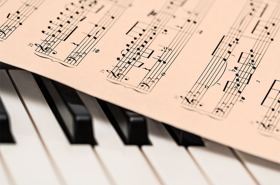 Sheet music on a piano keyboard.