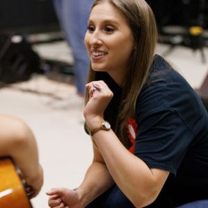 female teacher with guitar student