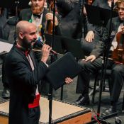 music teacher speaking during performance