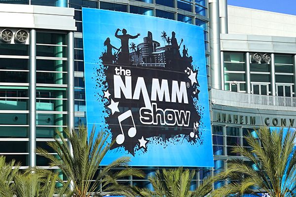 Outside view of Anaheim Convention Center with NAMM 2020 advertised on screen.