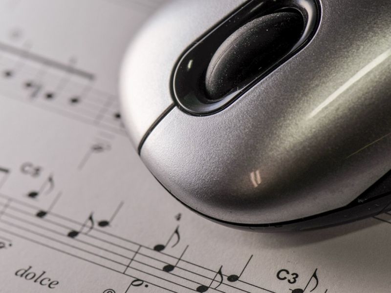 computer mouse on sheet music