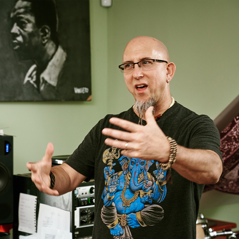 A man speaking passionately with his hands.