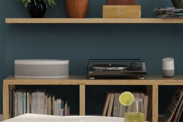 An image of a Google Home system on a shelf.