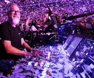 man using audio mixer with confetti falling down