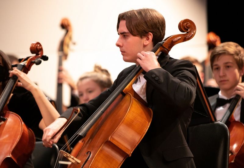 male cello player wearing tux