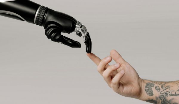 robot hand and human hand touching