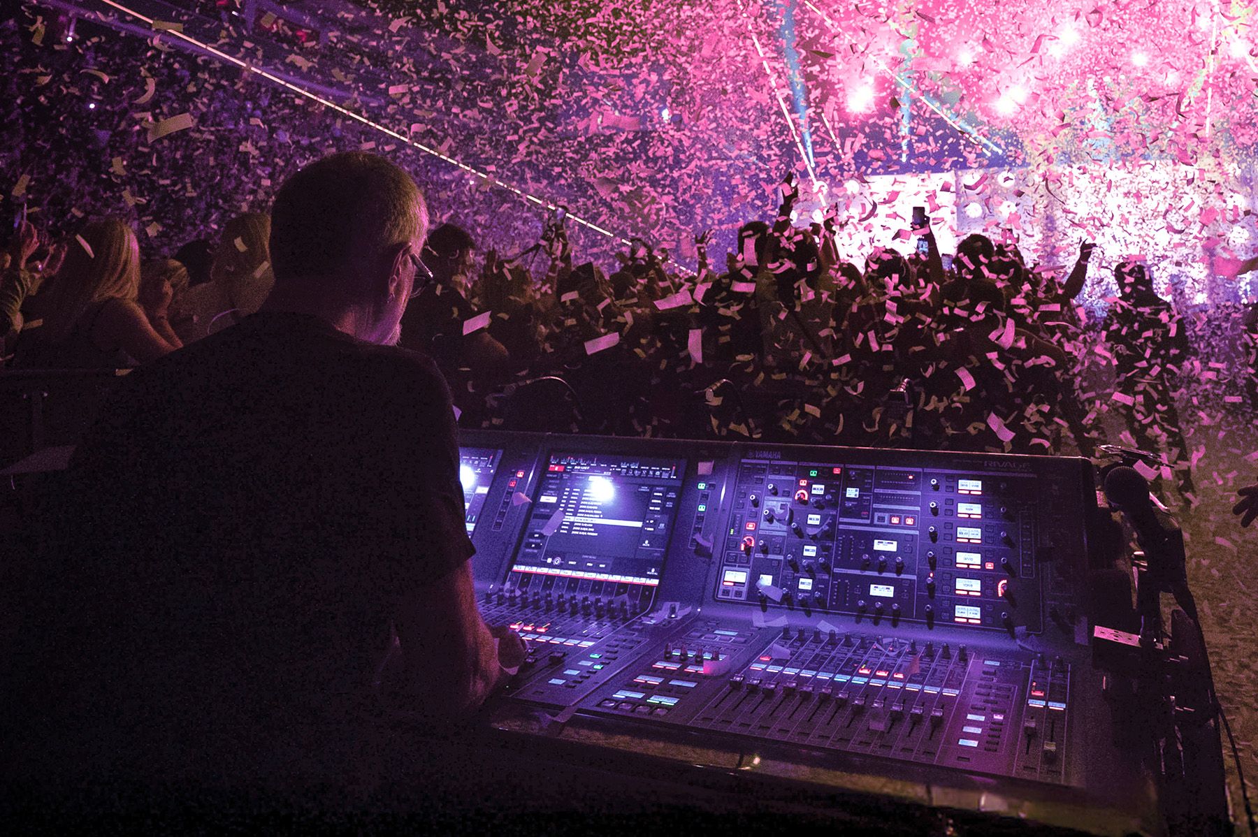man using audio mixer at concert