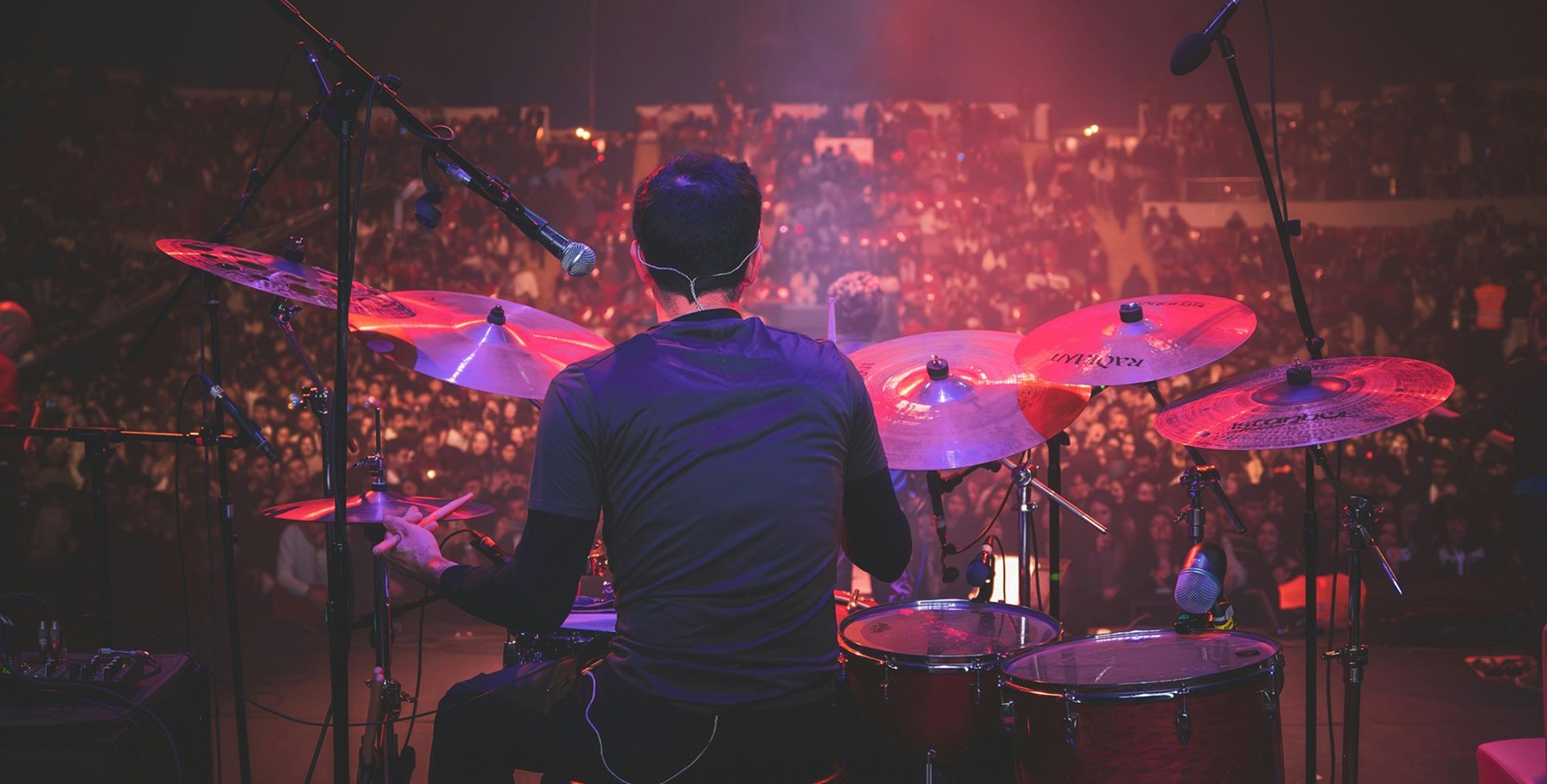 percussionist on drum set performing on stage