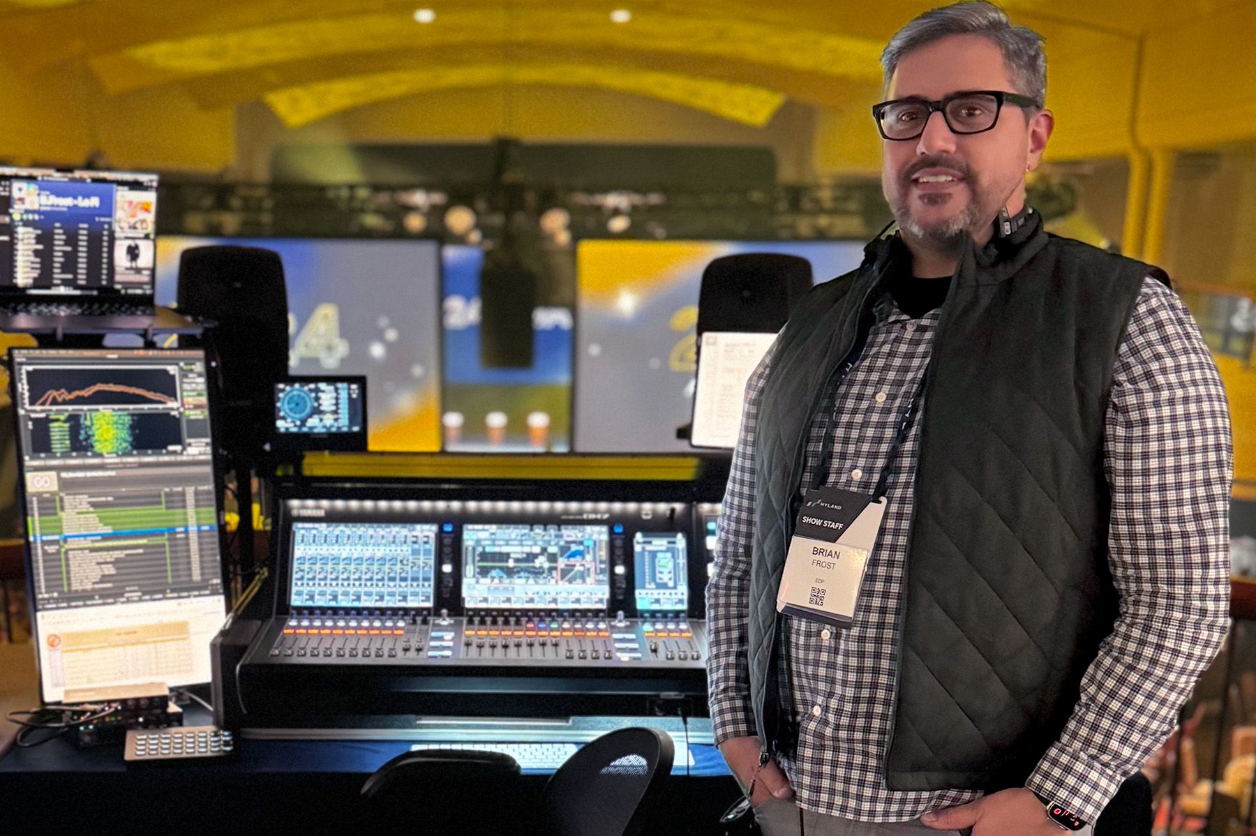 man in front of audio mixer