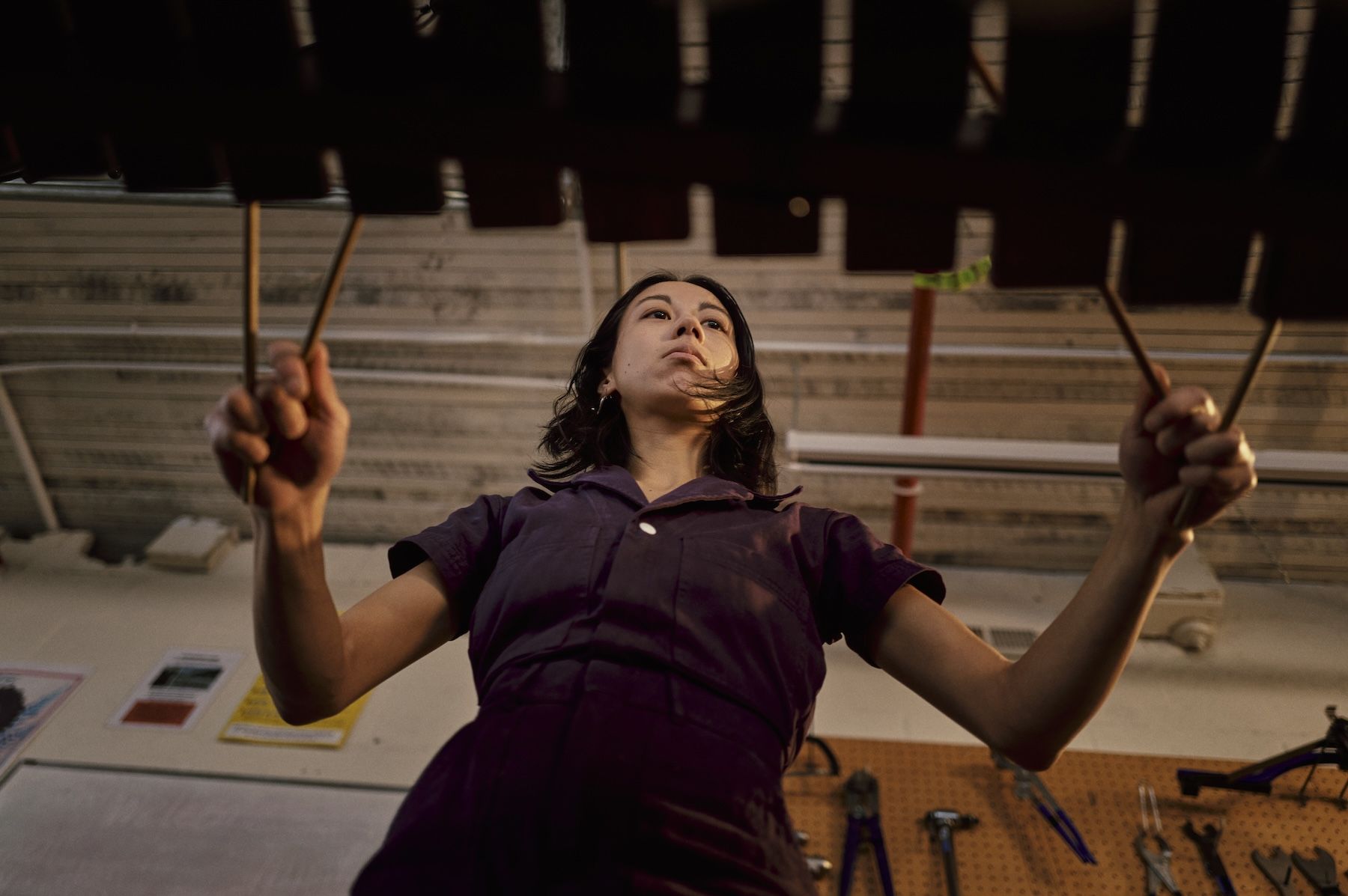 Hero image of a young woman playing an instrument.