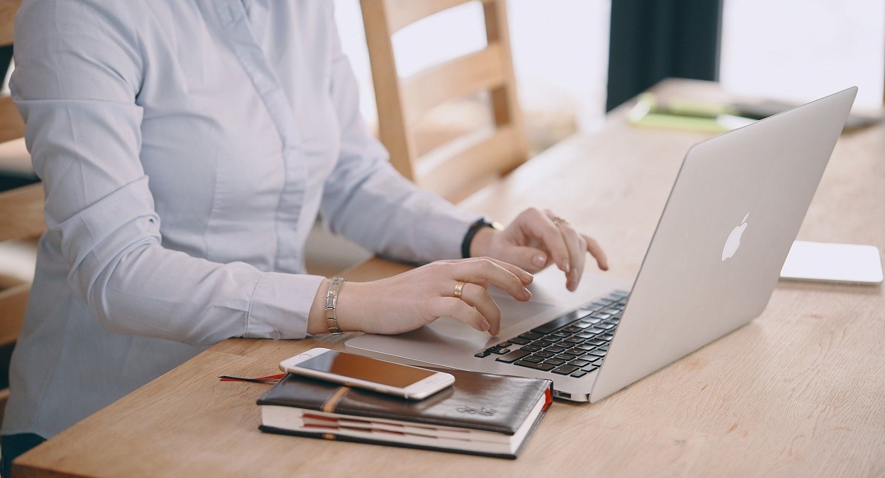 female sitting in front of laptop